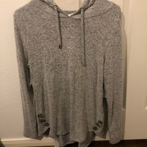 Gray hooded sweater with button accents.